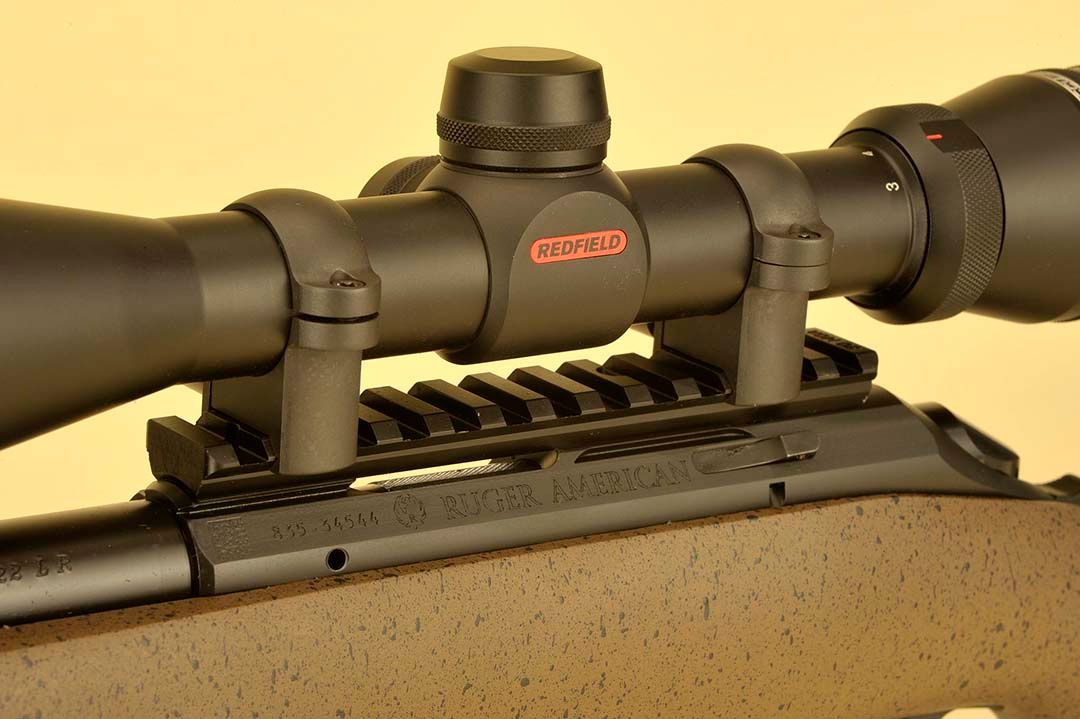 Ruger has always been known for the “added-value” details and on this long-range rifle, an aluminum scope rail is included for mounting. To this, a full-sized one-inch Redfield scope was attached in Leupold rings. Bolt release is just below the rear scope ring and base.